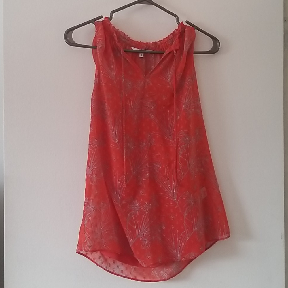 Red sleeveless blouse with shell underneath